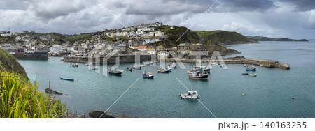 Panoramic view of the harbor at Mevagissey on the south coast of Cornwall, England. Panoramic view of the harbor at Mevagissey on the south coast of Cornwall, England. 140163235