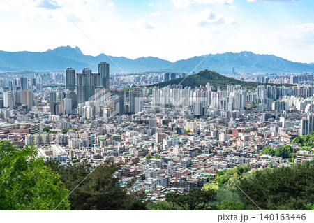 Seoul, South Korea - May. 08, 2026 : Panoramic cityscape of downtown Seoul with dense apartment complexes from Yongmasan mountain observatory on a clear spring afternoon Seoul, South Korea - May. 08, 2026 : Panoramic cityscape of downtown Seoul with dense apartment complexes from Yongmasan mountain observatory on a clear spring afternoon 140163446