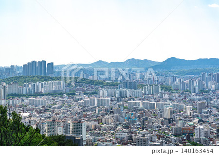 Seoul, South Korea - May. 08, 2026 : Panoramic cityscape of downtown Seoul with dense apartment complexes from Yongmasan mountain observatory on a clear spring afternoon Seoul, South Korea - May. 08, 2026 : Panoramic cityscape of downtown Seoul with dense apartment complexes from Yongmasan mountain observatory on a clear spring afternoon 140163454