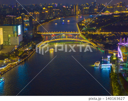 Aerial View of Guangzhou Skyline at Night with Illuminated Bridges and River Aerial View of Guangzhou Skyline at Night with Illuminated Bridges and River 140163627