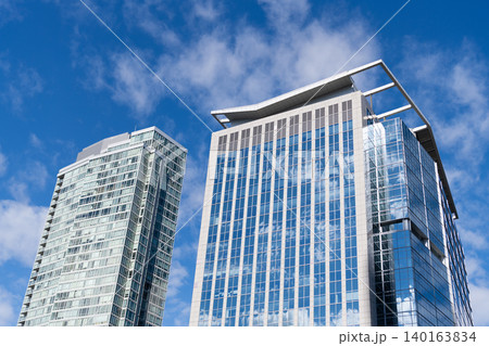 Glass building in metropolis. Skyscraper perspective view. City architecture. Architecture of modern glass building. Perspective city skyscraper. Modern skyscraper building. Building design 140163834