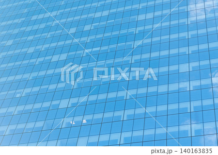 Background of glassy architecture. Modern glass background. Glass facade background. Architecture. Building facade architecture. Building background. Glass building window. Architectural detail 140163835
