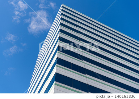 Perspective city skyscraper. Modern skyscraper building. Glass building in metropolis. Skyscraper perspective view. City architecture. Architecture of modern glass building. Architectural aesthetics 140163836