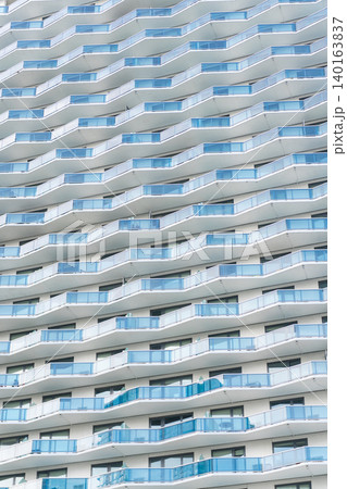 Modern glass background. Glass facade background. Architecture. Building facade architecture. Building background. Glass building balconies. Architectural detail. Background of architecture 140163837