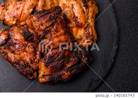 Chicken or turkey, poultry breast baked on the grill or barbecue. Grilled chicken Chicken or turkey, poultry breast baked on the grill or barbecue. Grilled chicken 140165743