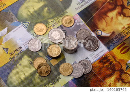 Switzerland, Swiss franc paper money and coins, financing and commodity exchange. Swiss currency Switzerland, Swiss franc paper money and coins, financing and commodity exchange. Swiss currency 140165763