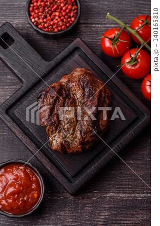 Beef mignon steak, rare, meat grilled with salt and spices. Beef steak Beef mignon steak, rare, meat grilled with salt and spices. Beef steak 140165810