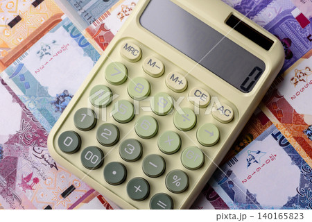 Qatar, Qatari riyal paper money and coins, financing and commodity exchange, trade. Qatari currency Qatar, Qatari riyal paper money and coins, financing and commodity exchange, trade. Qatari currency 140165823