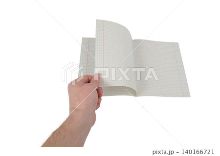a person turns the page of an open checkered notebook on a light background 140166721