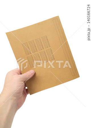 a person holds a notebook with a multiplication table on the back of the cover 140166724