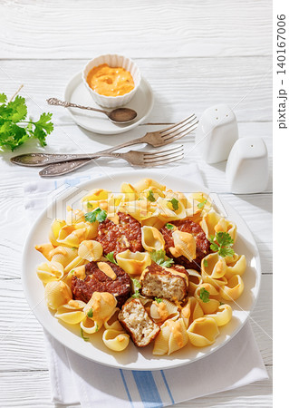 Shell Pasta And Meat Patties on a Plate Shell Pasta And Meat Patties on a Plate 140167006
