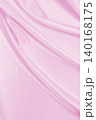 Smooth elegant pink silk or satin texture as wedding background. Luxurious background design 140168175