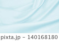 Smooth elegant blue silk or satin luxury cloth texture as abstract background. Luxurious background design 140168180