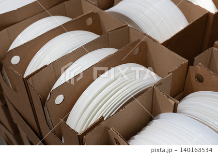 Boxes of white plates in crockery shop, dishware, tableware stack in store 140168534