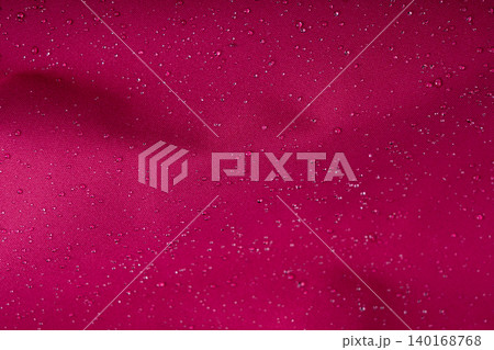 Waterproof fabric texture with rain drops closeup Waterproof fabric texture with rain drops closeup 140168768