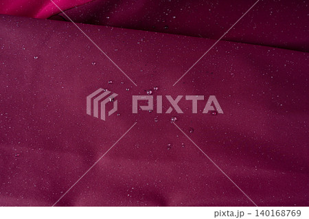 Waterproof fabric texture with rain drops closeup Waterproof fabric texture with rain drops closeup 140168769