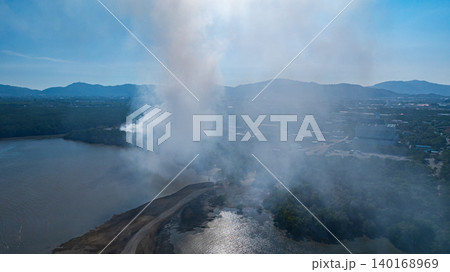 Aerial view of Smoke Rising from Waste Site 140168969