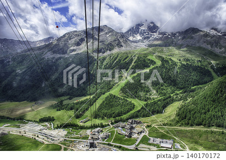 Ascending Schnalstal Glacier by cable car in the Italian Alps Ascending Schnalstal Glacier by cable car in the Italian Alps 140170172
