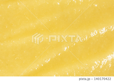 Abstract background of fresh blended yellow fruit mash. Abstract background of fresh blended yellow fruit mash. 140170422