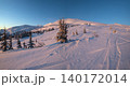 Alpine resort ski slopes and lifts. Pre sunrise morning Svydovets mountain ridge and snow-covered fir trees view, Dragobrat, Ukraine Carpathians. 140172014