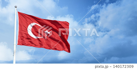 Turkish flag waving in the blue, cloudy sky. Turkish flag waving in the blue, cloudy sky. 140172309