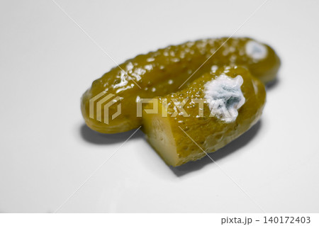 Spoiled Pickles with Mold. Concept of food spoilage, hygiene, and fermentation process Spoiled Pickles with Mold. Concept of food spoilage, hygiene, and fermentation process 140172403