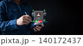 A person using a smartphone receives an unknown caller alert with security icons, representing mobile protection, scam prevention, cybersecurity awareness, and digital safety in modern communication. 140172437