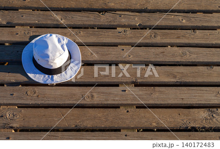 White Hat with Black Band on Pier at Spanish Beach White Hat with Black Band on Pier at Spanish Beach 140172483