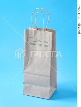 A brown paper bag for shopping on background. A brown paper bag for shopping on background. 140172668