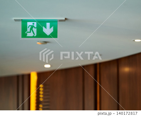 Directional sign guiding to safety in a building 140172817