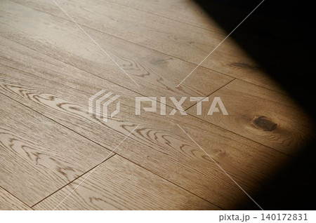 Light dancing on an elegant wooden floor Light dancing on an elegant wooden floor 140172831