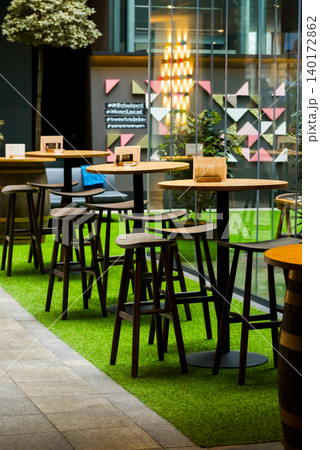 Stylish workspace with greenery and seating Stylish workspace with greenery and seating 140172862