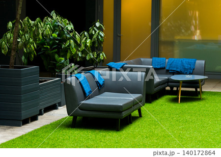Comfortable seating in a tranquil courtyard space Comfortable seating in a tranquil courtyard space 140172864