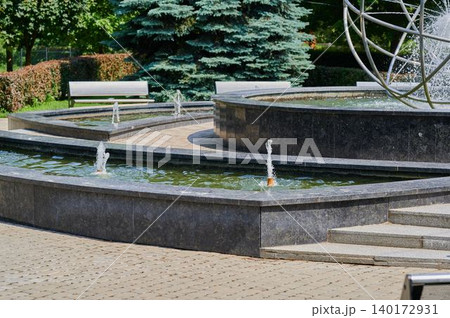 Serene fountain scene captivates park visitors Serene fountain scene captivates park visitors 140172931