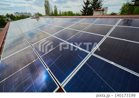 Solar panels gleam on city rooftops 140173199