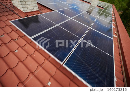 Harnessing sunlight with solar panels on a rooftop 140173216