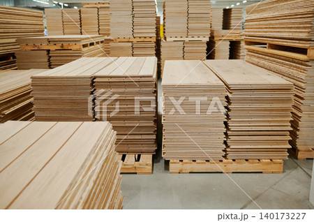 Stacks of freshly cut wood ready for construction Stacks of freshly cut wood ready for construction 140173227