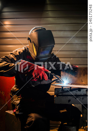 Sparks fly as the welder crafts metal art Sparks fly as the welder crafts metal art 140173248