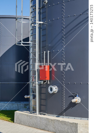 Modern industrial storage tanks in bright sunlight 140173255