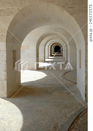 Arched corridor in the 19th century Spanish fortress of La Mola on the Spanish island of Menorca Arched corridor in the 19th century Spanish fortress of La Mola on the Spanish island of Menorca 140173378
