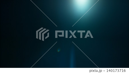 Anamorphic lens flare and light leak effect on dark background. Minimal cinematic optical texture ideal for overlays, film production, motion graphics and visual effects. 140173716