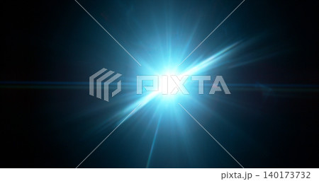 Intense cinematic light flare radiating from a bright source on dark background. Realistic optical effect ideal for film production, visual effects and dramatic compositions. Intense cinematic light flare radiating from a bright source on dark background. Realistic optical effect ideal for film production, visual effects and dramatic compositions. 140173732