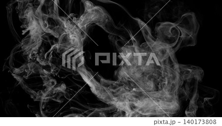 Delicate white smoke wisps drifting across a dark background. Atmospheric abstract texture with soft swirling patterns, ideal for creative design, overlays and visual effects projects. Delicate white smoke wisps drifting across a dark background. Atmospheric abstract texture with soft swirling patterns, ideal for creative design, overlays and visual effects projects. 140173808