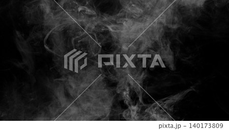 Delicate white smoke wisps drifting across a dark background. Atmospheric abstract texture with soft swirling patterns, ideal for creative design, overlays and visual effects projects. 140173809