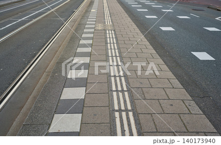 Exploring the Unique Pathways Vibrant City Center With Artistic Pavement Designs and Tram Tracks 140173940