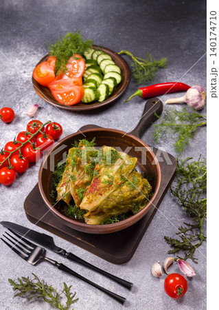 Stuffed cabbage rolls golubtsy with fresh vegetables Stuffed cabbage rolls golubtsy with fresh vegetables 140174710
