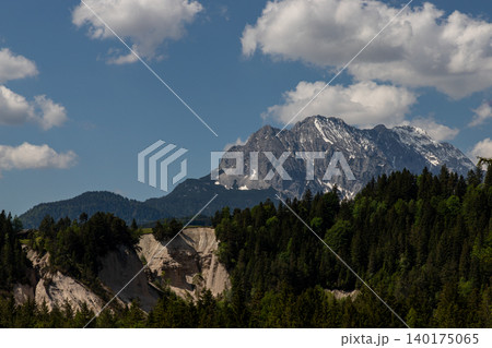 Rugged Bavarian Alpine Mountain Above Green Forest Rugged Bavarian Alpine Mountain Above Green Forest 140175065