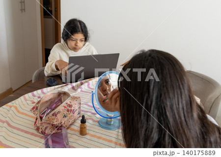 Teen Applying Makeup at Home Teen Applying Makeup at Home 140175889