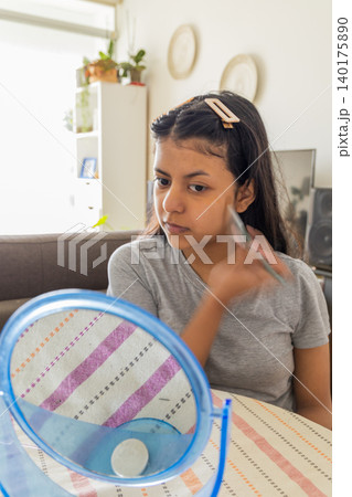 Teen Applying Makeup at Home 140175890