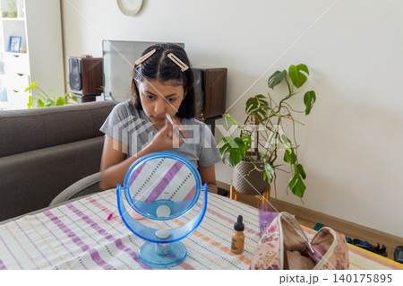 Teen Applying Makeup at Home Teen Applying Makeup at Home 140175895